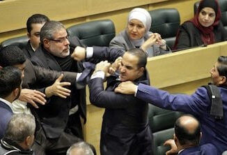 Jordan lawmakers throw punches during heated Parliament session shown live on national tv (video)
