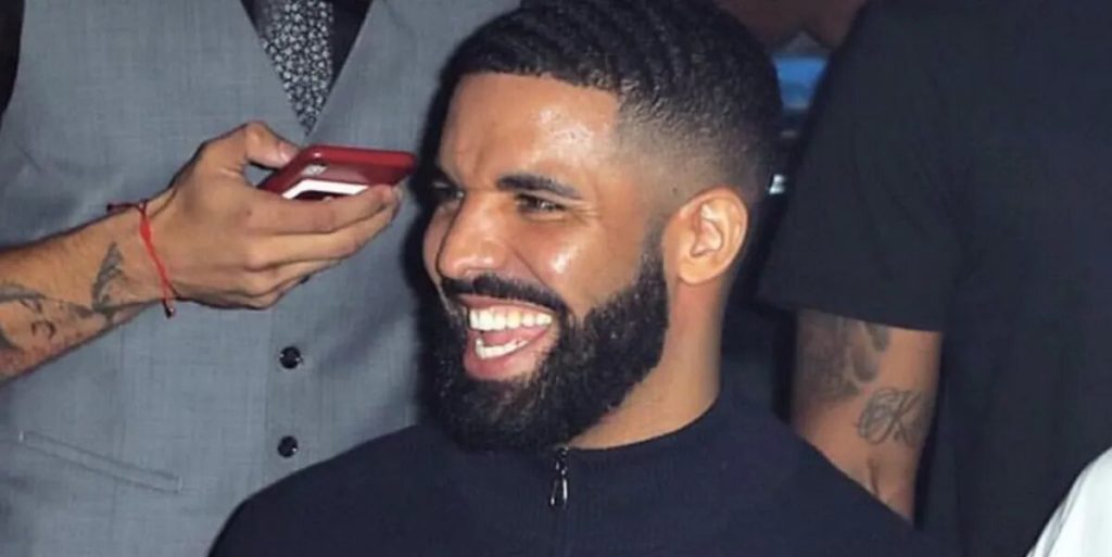  Image of Drake Examines A Woman’s Bra Onstage